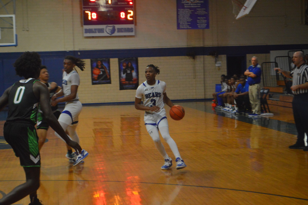 Bolton senior guard Jaylen Welch (3) dribbles the ball up the floor during the Bears' first-round matchup against Livingston Collegiate in the first round of the LHSAA Division II select playoffs. 